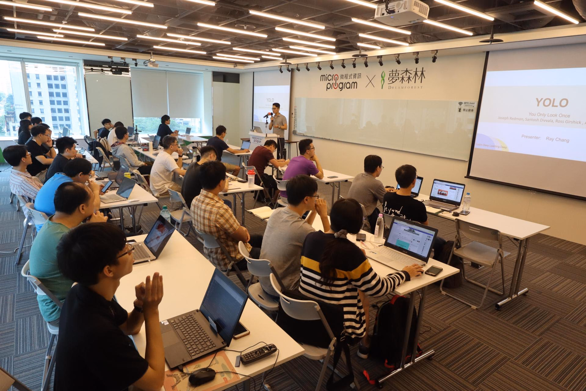 The presenter at the podium during a study-group lecture.